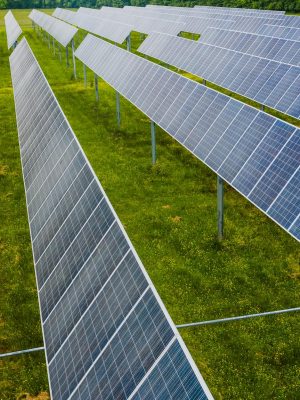 Aerial view of solar panels in a green field, Rossville, GA.