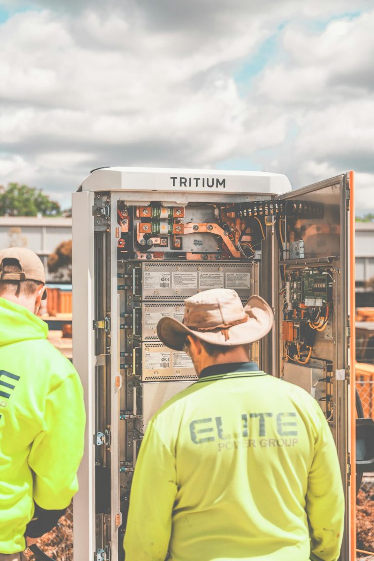 Technicians work on installing a Tritium EV charger in New South Wales, Australia.