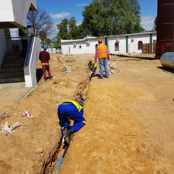 Crew preparing an underground electrical route