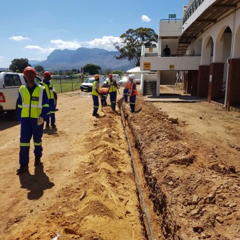 Trenching for stadium lighting infrastructure