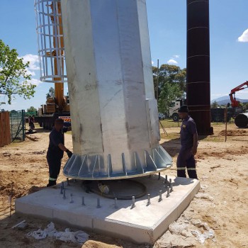 Mast erection by crane